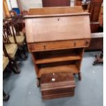 A 20th century bureau and a sewing machine