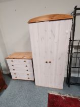 A lime-washed pine wardrobe and five-height chest of drawers