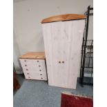 A lime-washed pine wardrobe and five-height chest of drawers