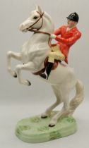 A Beswick rearing Huntsman on a white horse plus a Royal Worcester PHLEGON horse figure