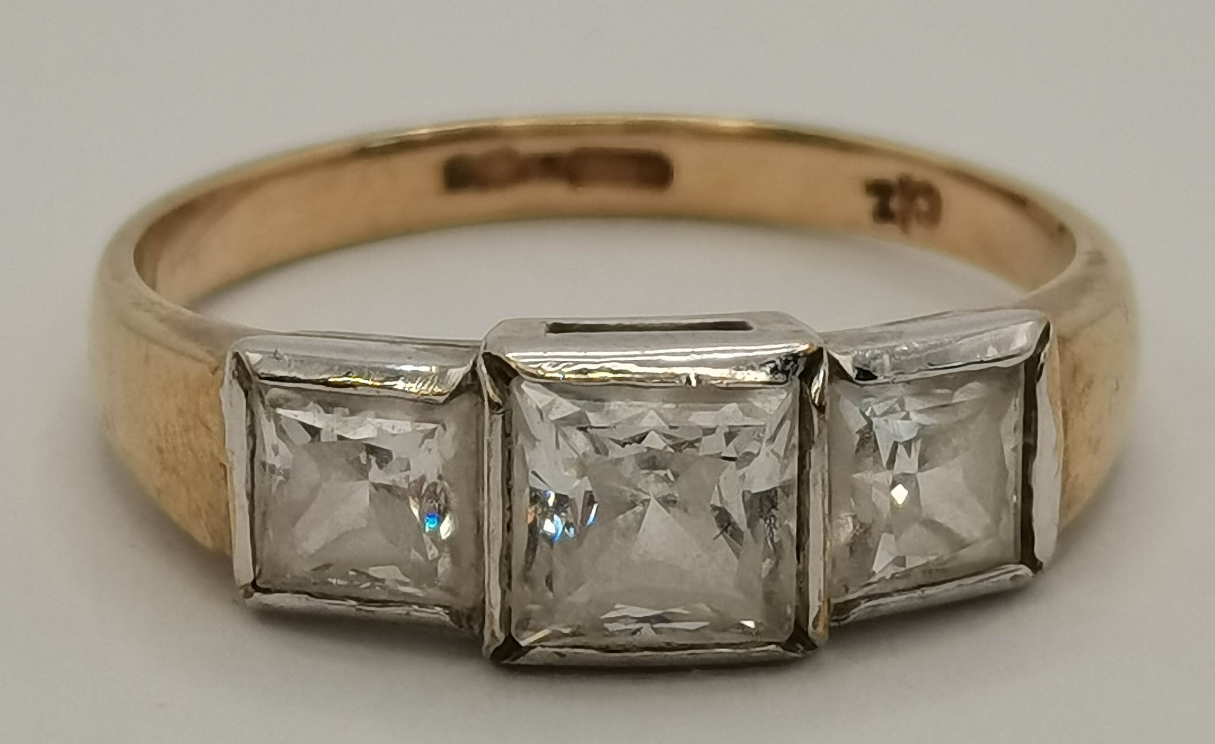 An 18 carat gold blue and white stone cluster ring, and a 9 carat gold white three stone ring - Image 2 of 9