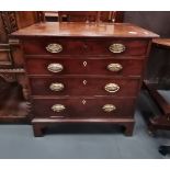 A Georgian mahogany small 4 height chest with attractive brass handles on bracket feet