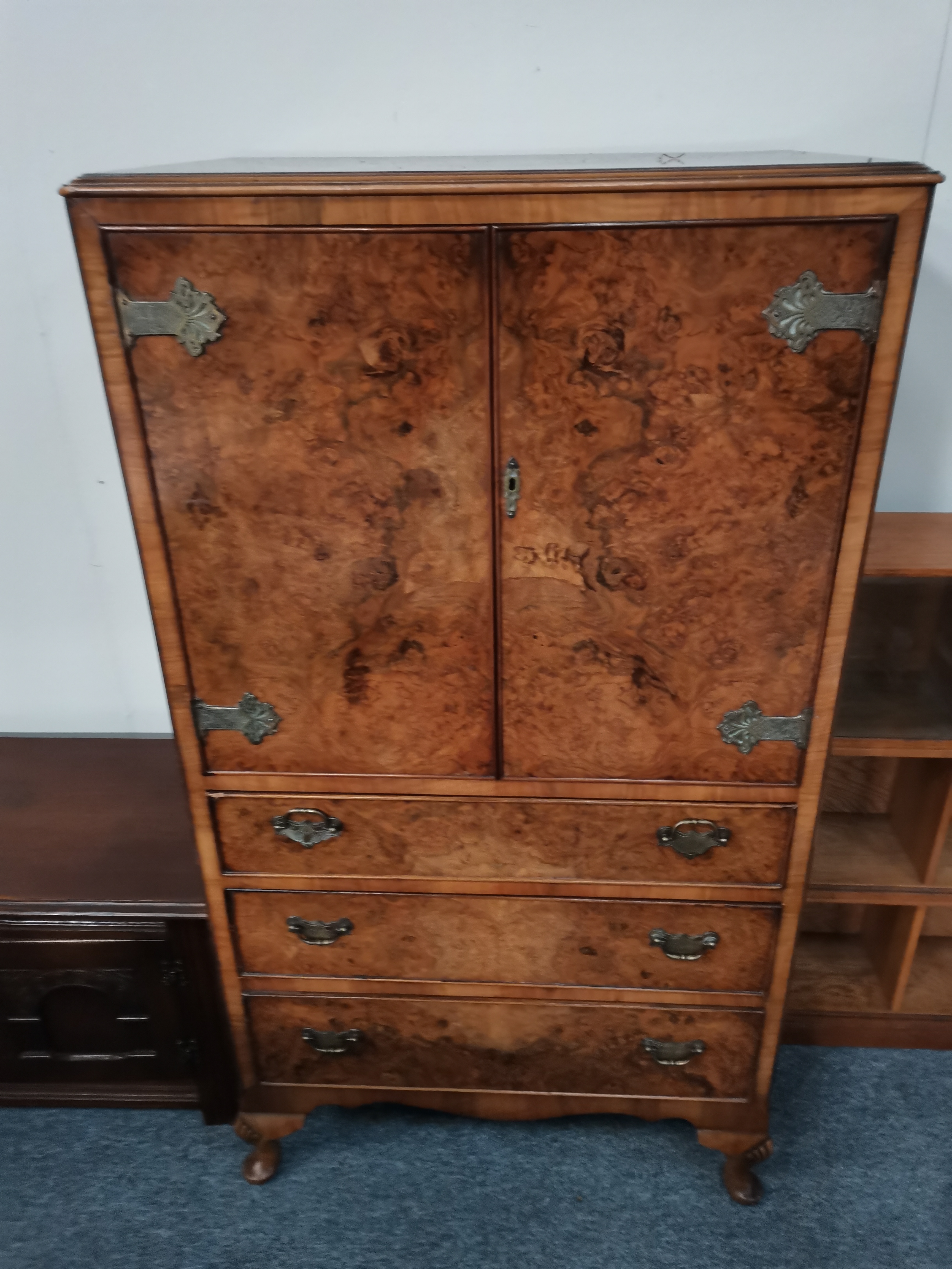 A 20th century walnut drinks cabinet