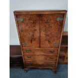 A 20th century walnut drinks cabinet