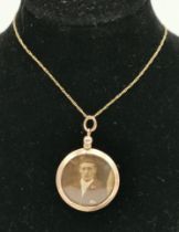 A 9 carat gold open-faced double-sided locket on chain