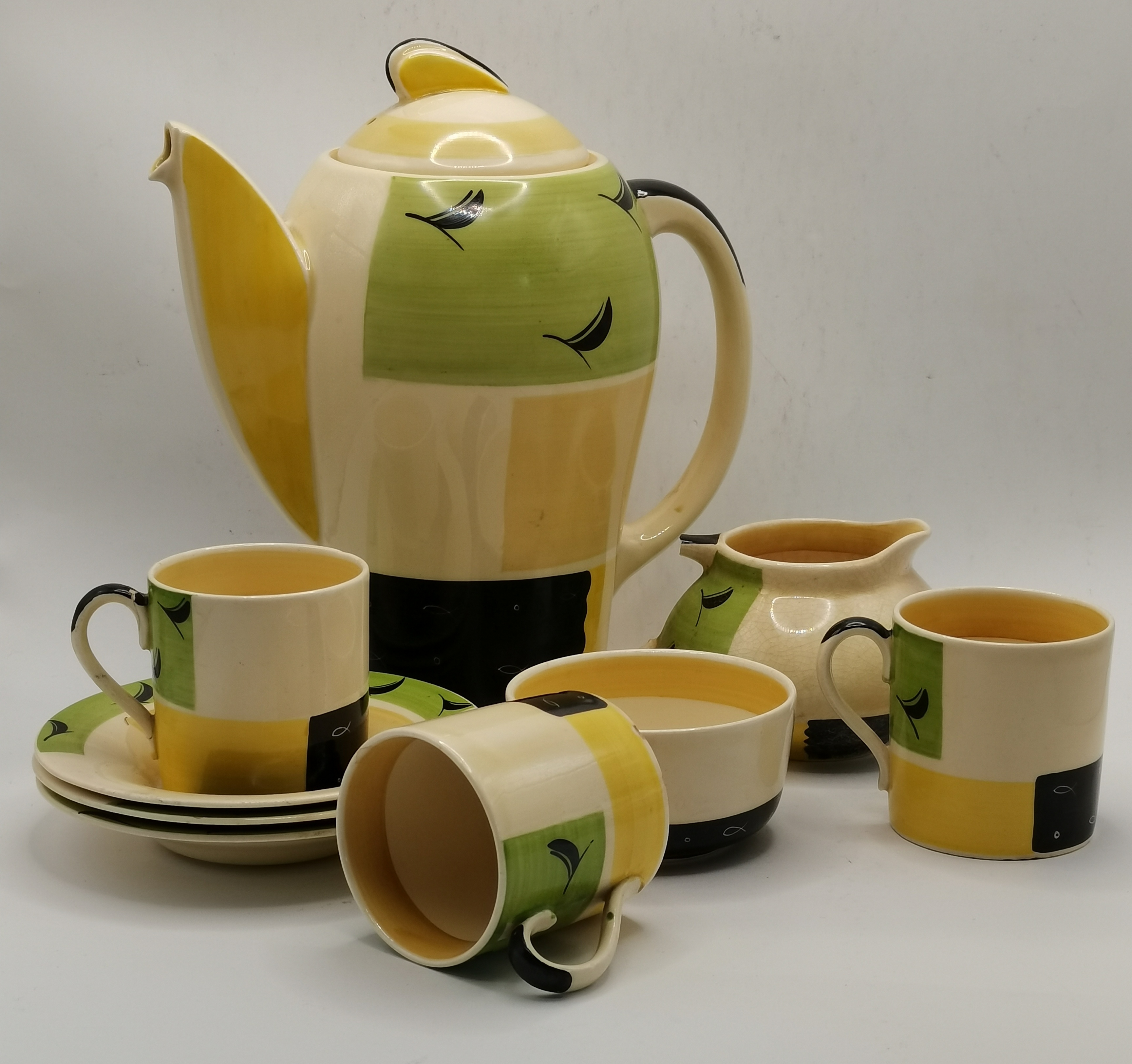 An Art Deco Kestrel coffee set by Susie Cooper