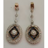 A pair of Art Deco platinum and 18 carat gold diamond and sapphire pendant earrings