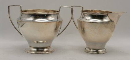 A George VI silver cream jug and twin-handled sugar bowl