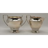 A George VI silver cream jug and twin-handled sugar bowl