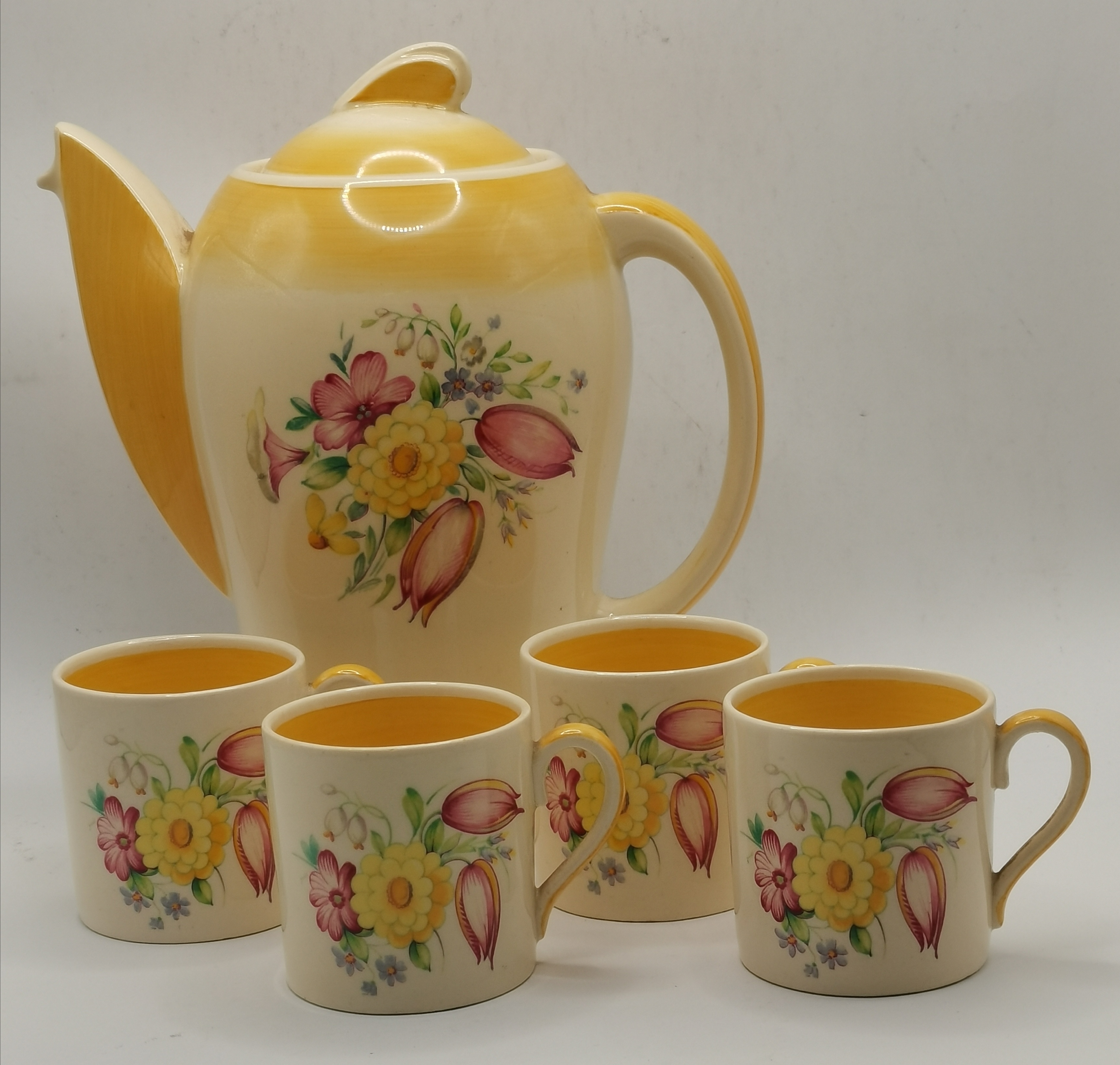 A yellow 'Swansea Spray' Kestrel part-coffee set by Susie Cooper