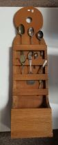 A vintage large pine spoon rack with 4 compartments