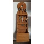 A vintage large pine spoon rack with 4 compartments