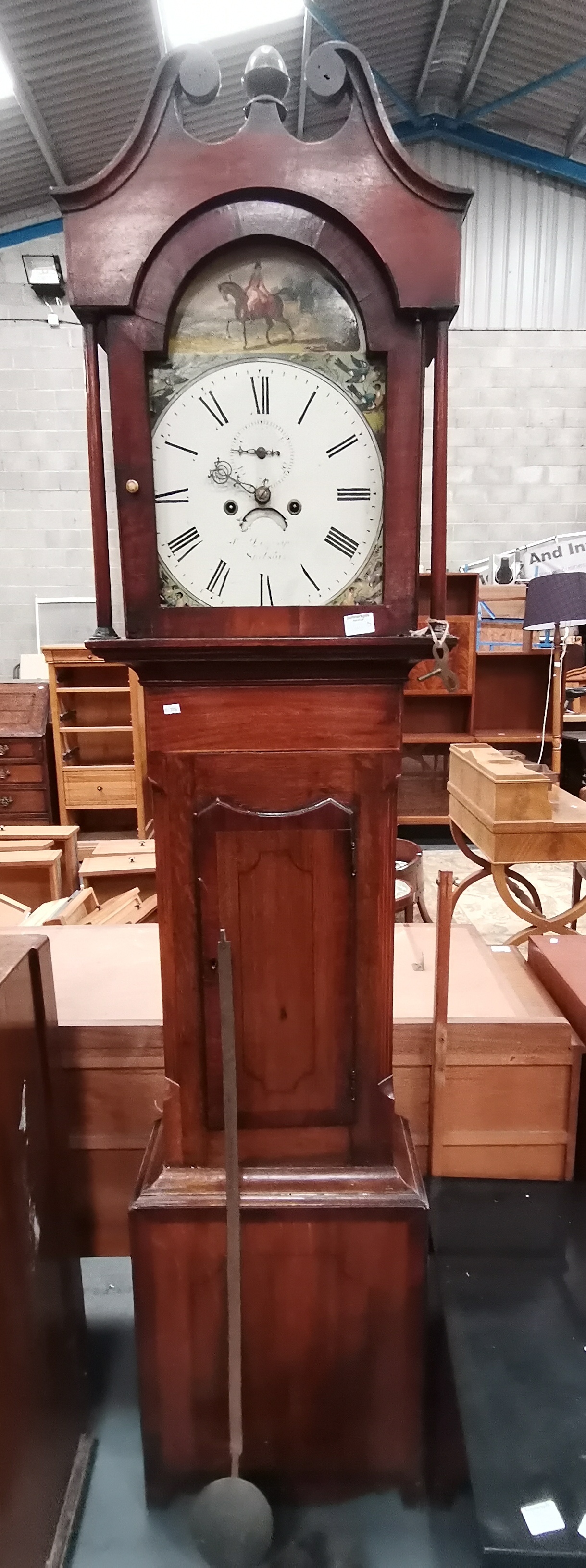 An 8 day oak long case clock made in Silsby Lincoln