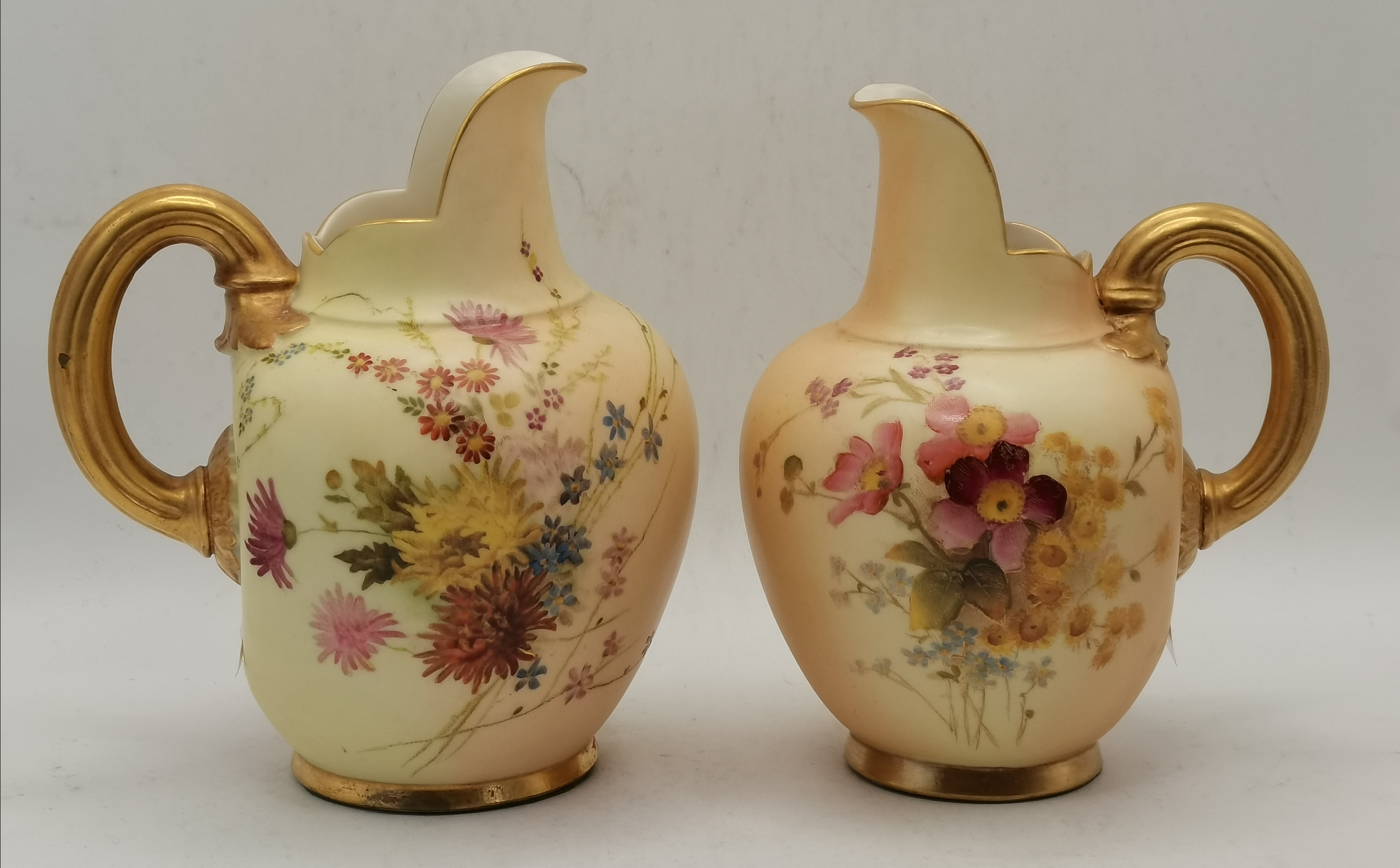 Two Royal Worcester porcelain flat back Ewers