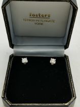 A pair of 18ct gold white gold diamond earrings
