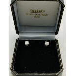 A pair of 18ct gold white gold diamond earrings