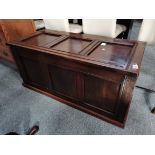 A 20th century oak blanket box with 3 x panel decoration