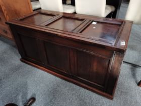 A 20th century oak blanket box with 3 x panel decoration