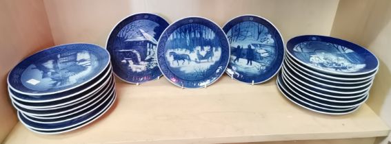A set of Christmas plates by Royal Copenhagen x 22