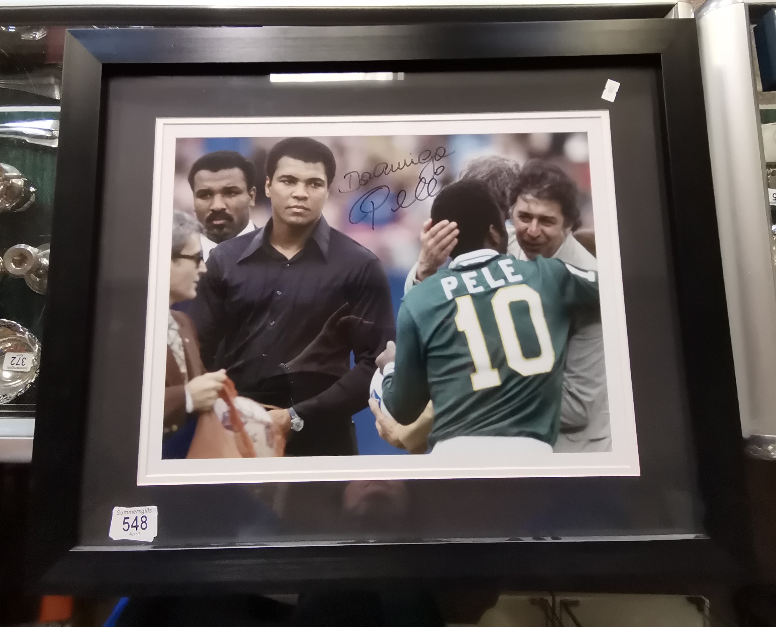 A signed colour photo of MOHAMMAD ALI and PELE signed by Pele