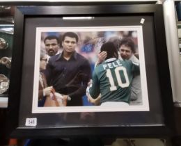 A signed colour photo of MOHAMMAD ALI and PELE signed by Pele