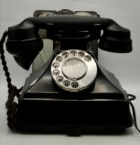 A Bakelite rotary dial telephone