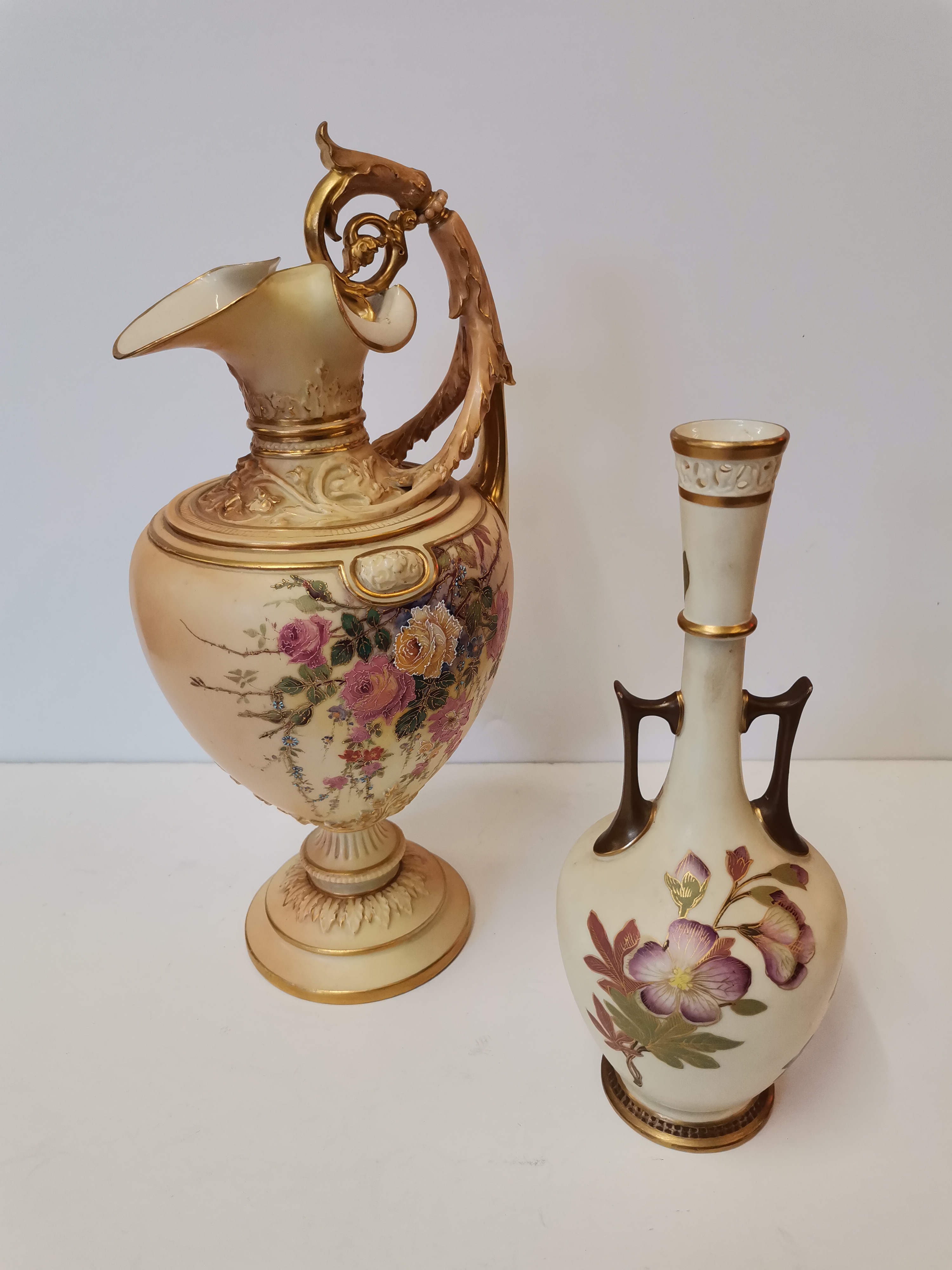 A Royal Worcester blush ivory ewer and twin-handled vase