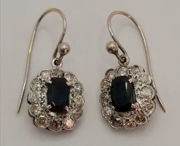 A pair of diamond and sapphire cluster pendant earrings, early 20th Century