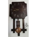 An Arts and Crafts style oak wall clock made by W.M Gilbert clock co.