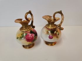 A pair of Royal Worcester jugs, one signed by Harry Austin
