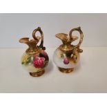 A pair of Royal Worcester jugs, one signed by Harry Austin