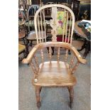 A broad high backed WINDSOR chair