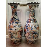 An impressive pair of Imari style large floor standing vases