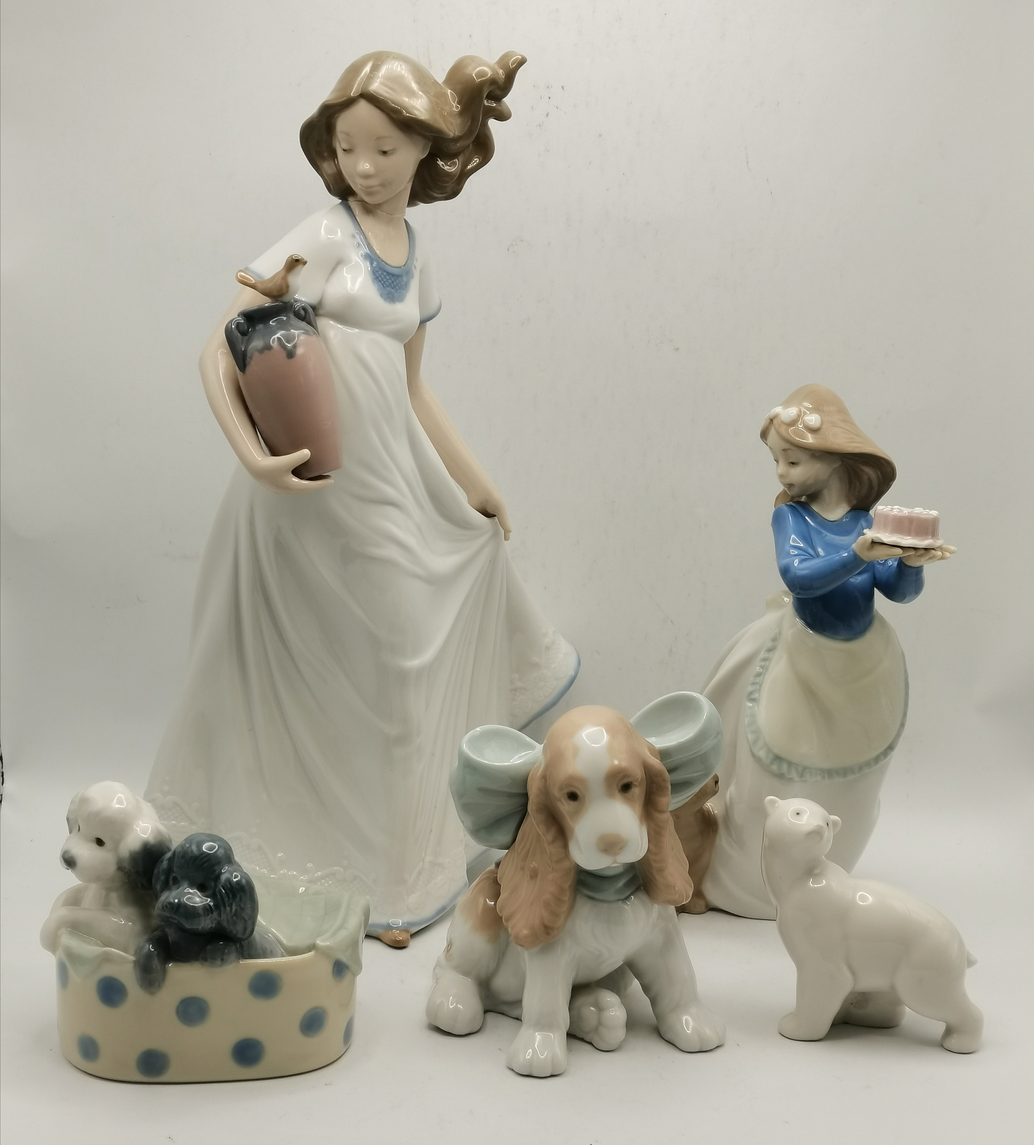 A group of five Nao porcelain models