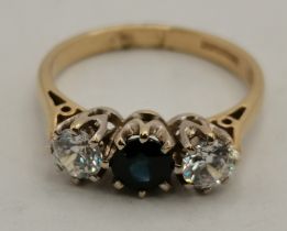A 9 carat gold sapphire and diamond three-stone ring