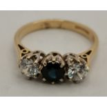 A 9 carat gold sapphire and diamond three-stone ring