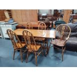 Oak refectory dining table with mid century spindle back chairs x4 plus wheel back Windsor chair