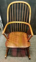 A spindle backed rocking WINDSOR CHAIR