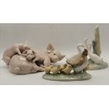 Two Nao porcelain animal figure groups, and a Lladro group