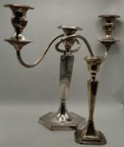 A George V silver candlestick and a silver-plated three-light candelabrum