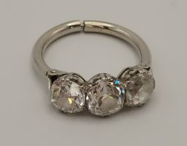 An impressive platinum three-stone diamond ring