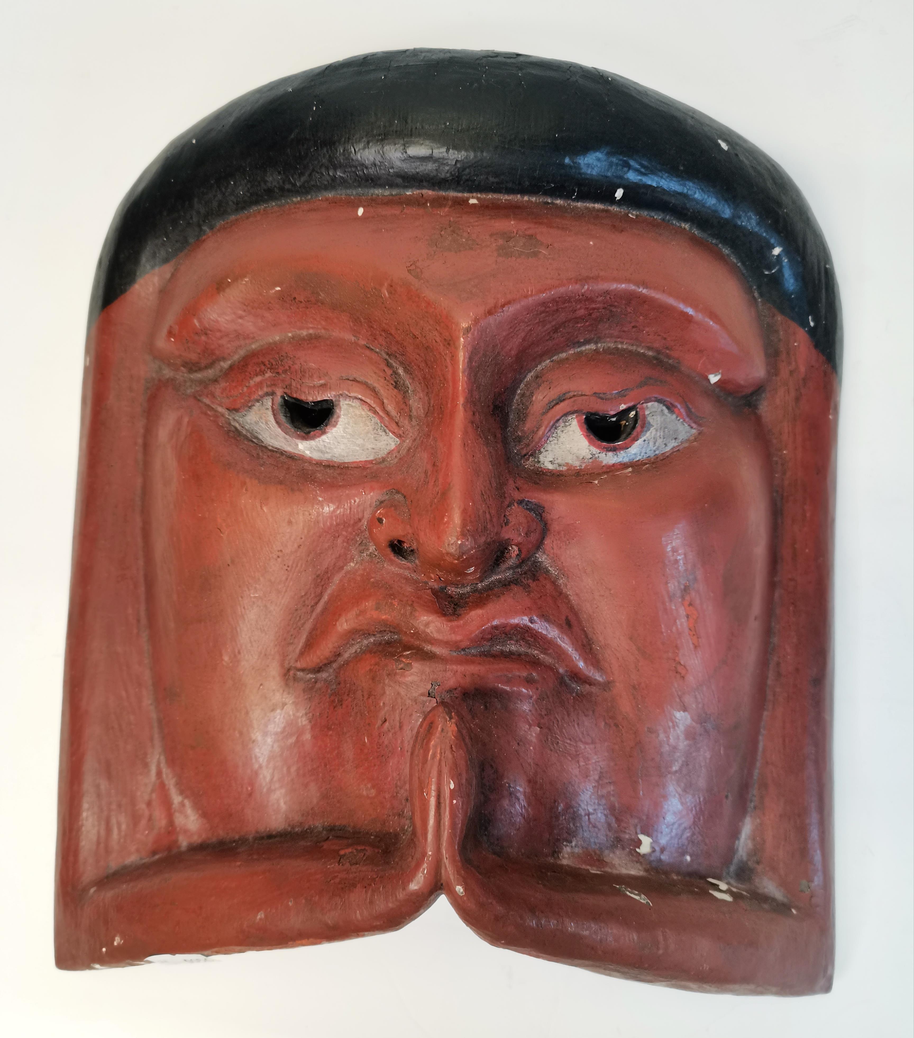 A carved wooden tribal mask
