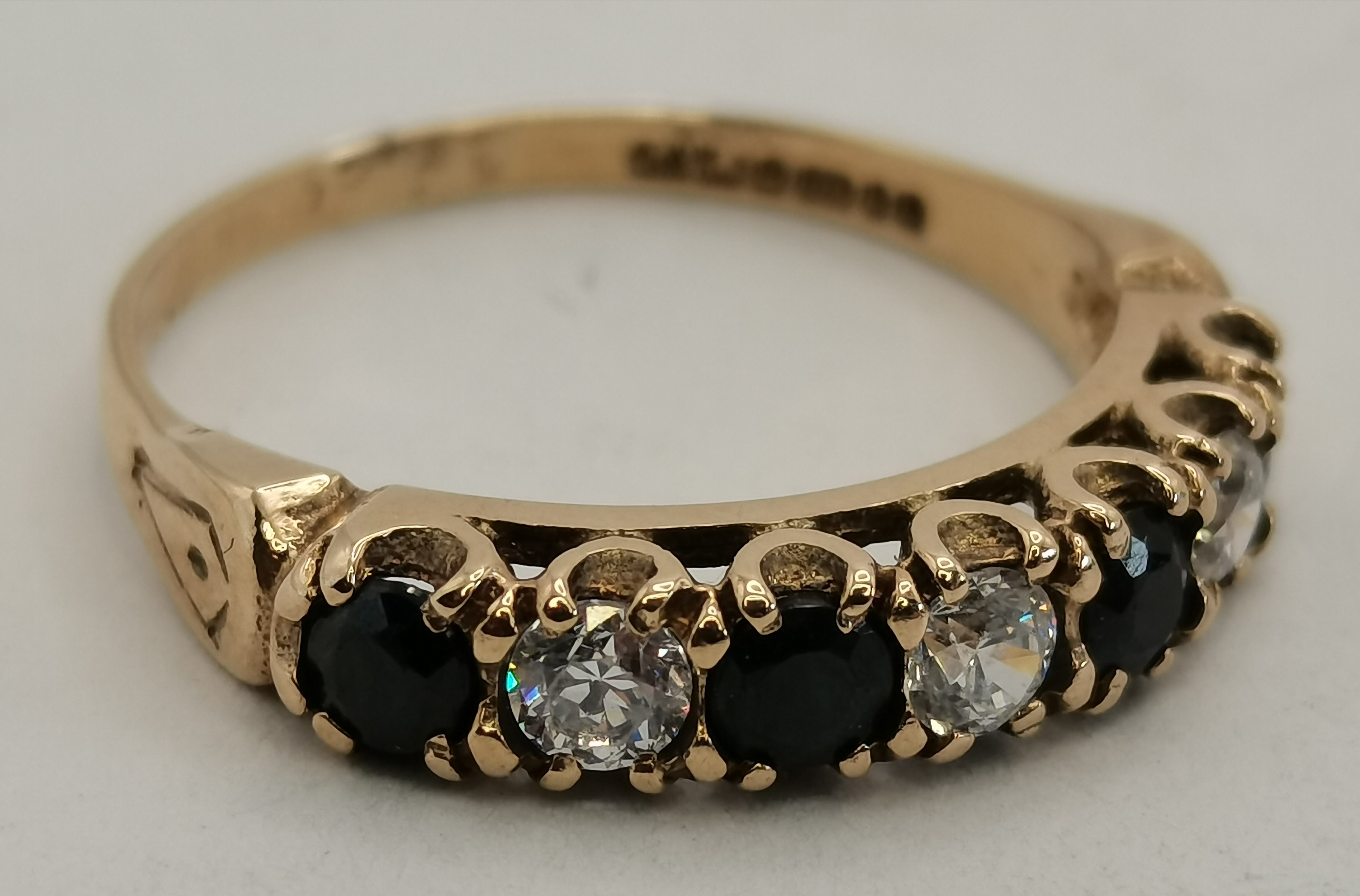 A 9 carat gold sapphire and diamond seven-stone ring - Image 2 of 5