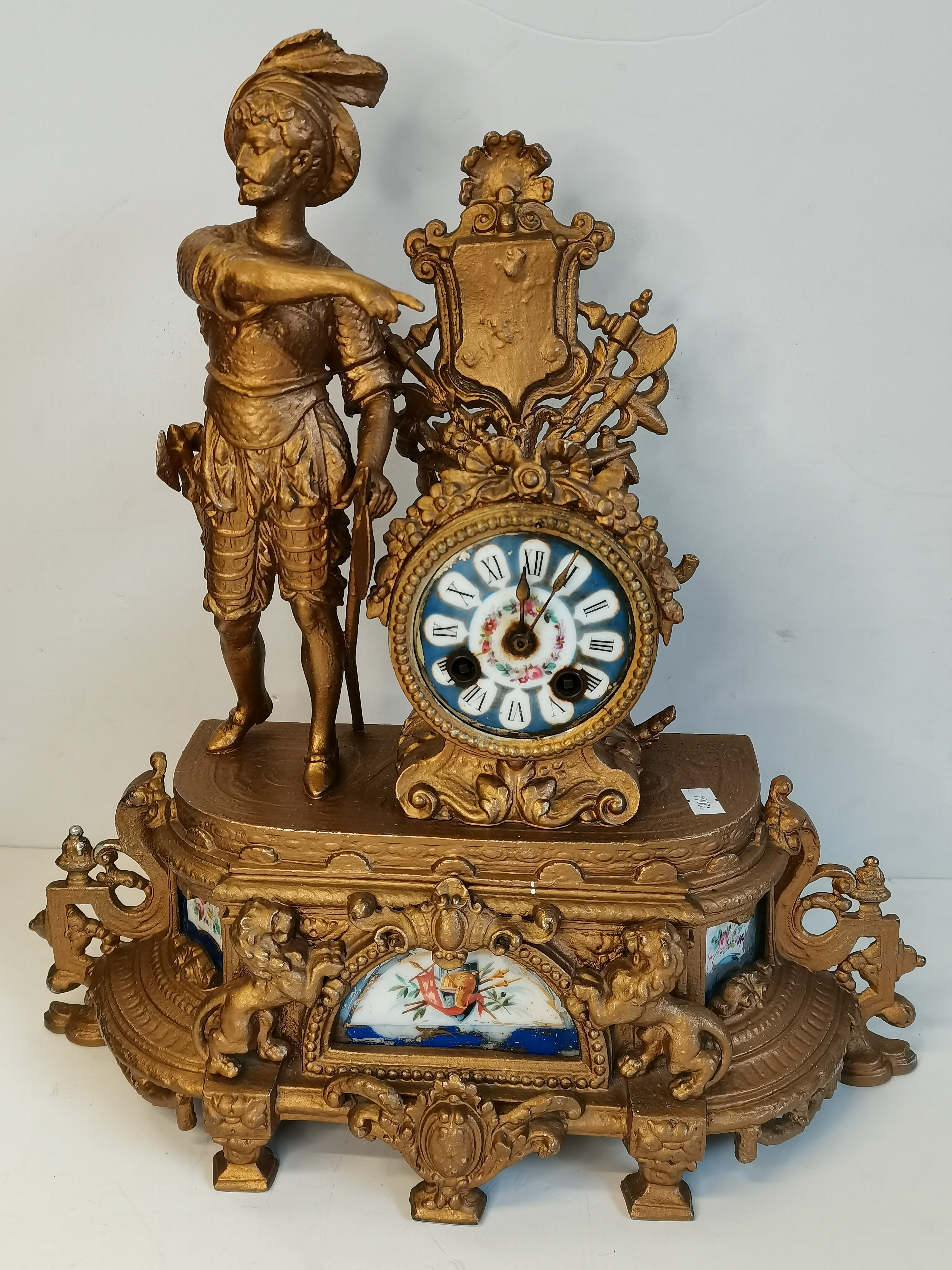 A late 19th Century French style metal and porcelain mantel clock