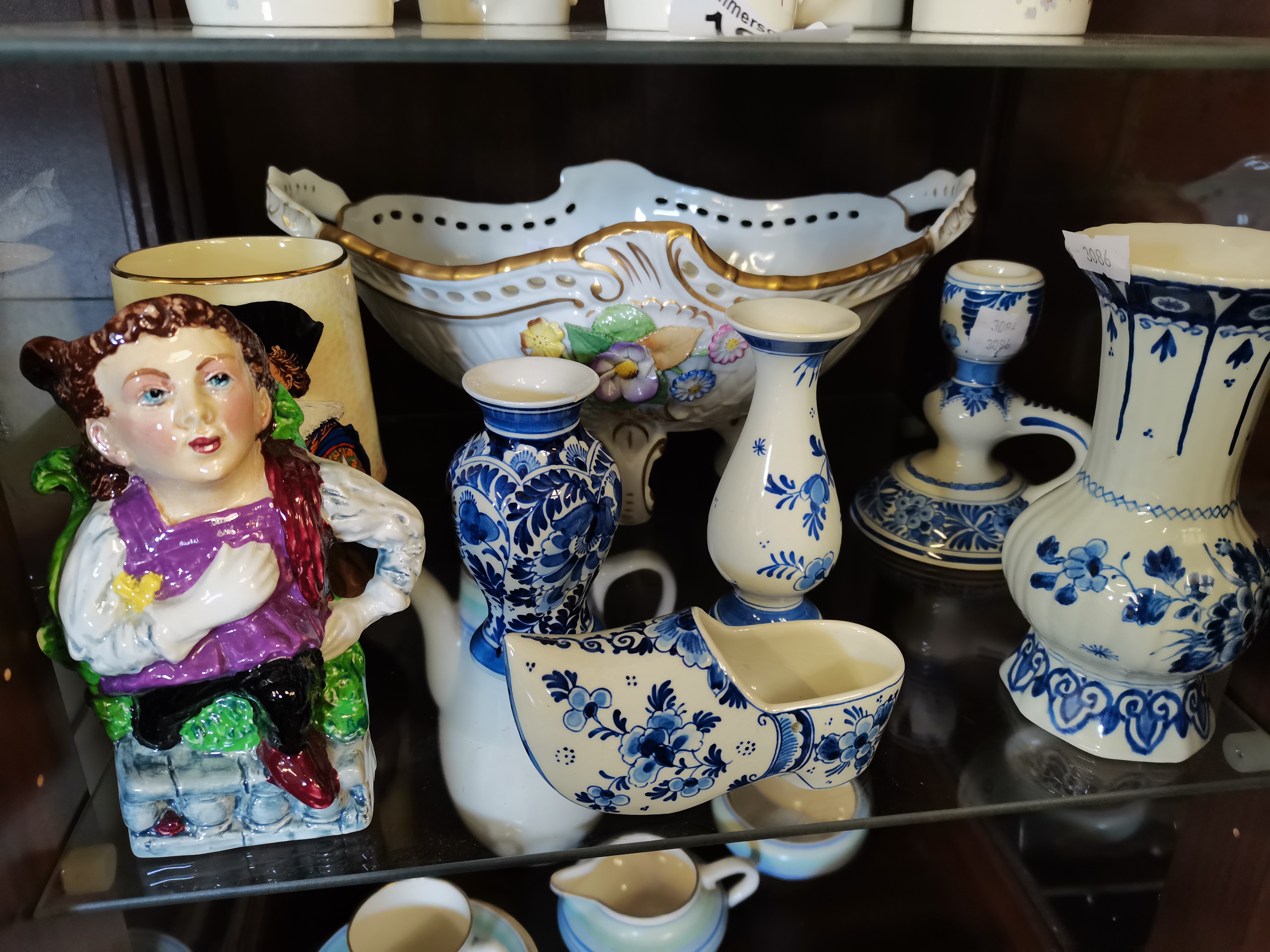 A collection of Delft blue and white china, Miniature toby jug, etc.