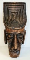 A vintage carved wooden mask