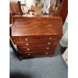 A Georgian mahogany and inlaid bureau