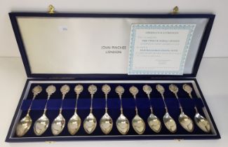 A set of twelve Elizabeth II silver Zodiac spoons