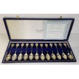 A set of twelve Elizabeth II silver Zodiac spoons