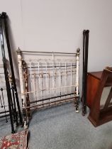 A 4-foot brass and iron bed frame